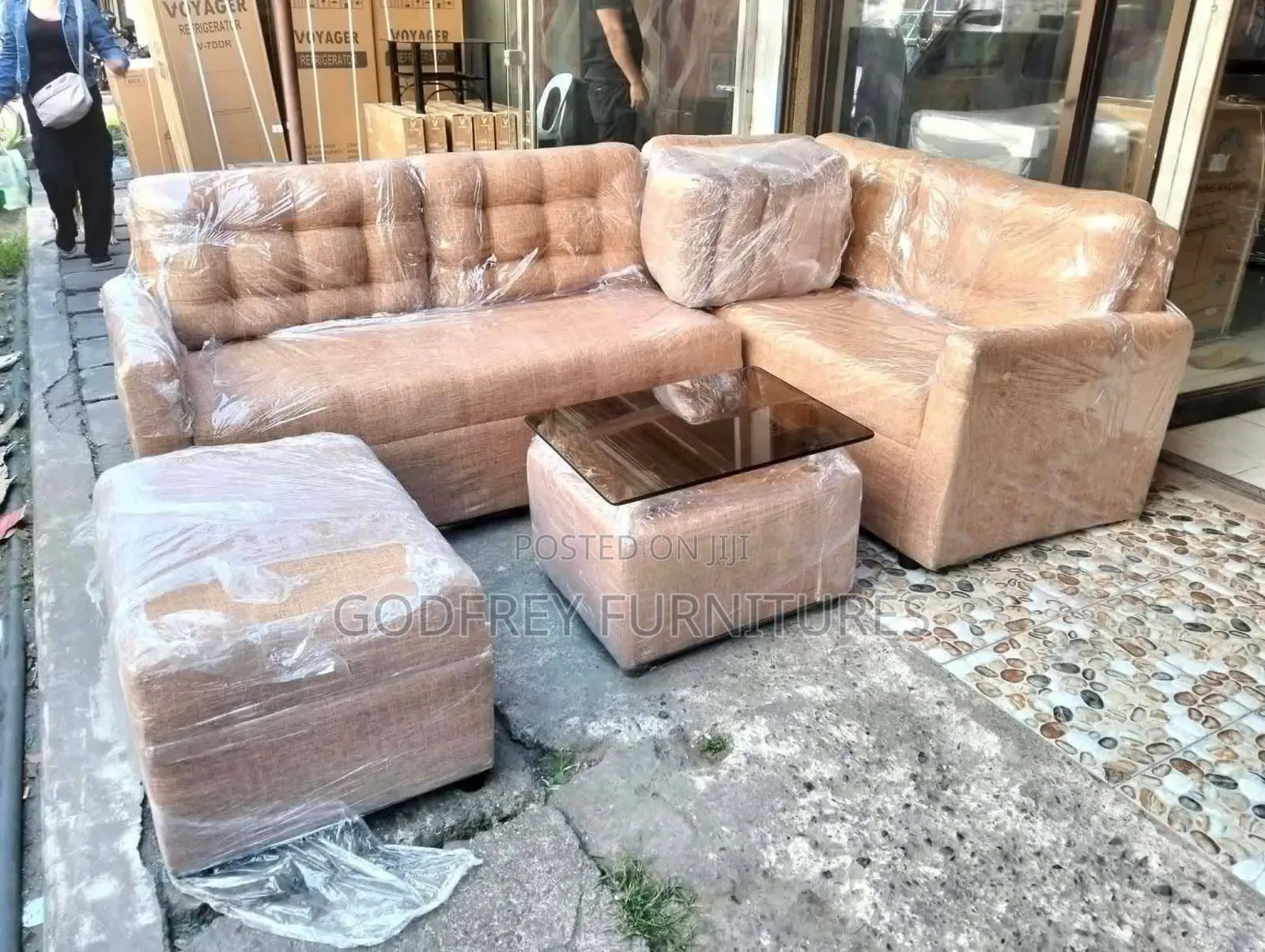 L Shaped Sofa With a Table and Leg Rest
