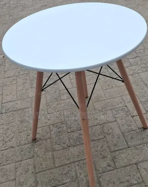 Dining Table Features a Smooth, Matte White Top