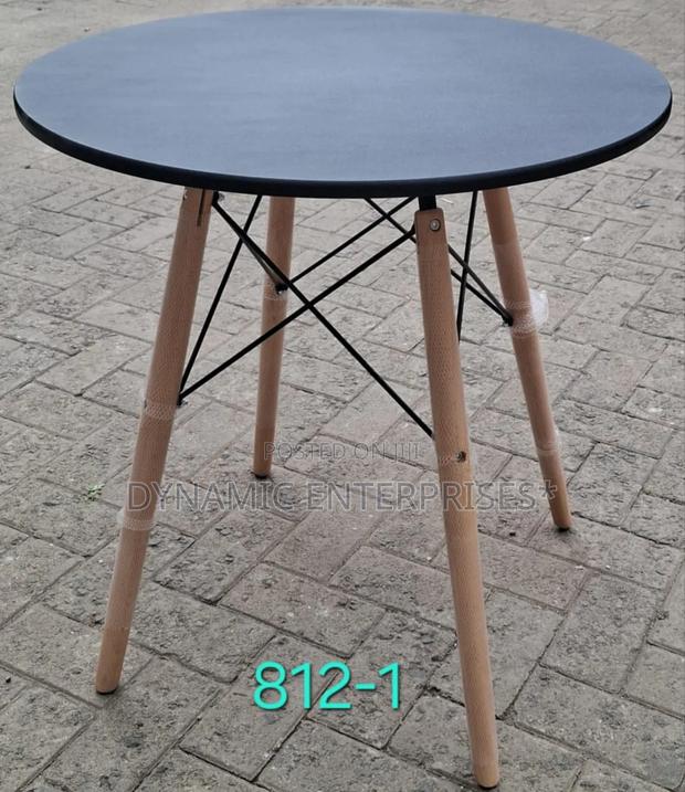 Dining Table Features a Smooth, Matte White Top - thumbnail 2