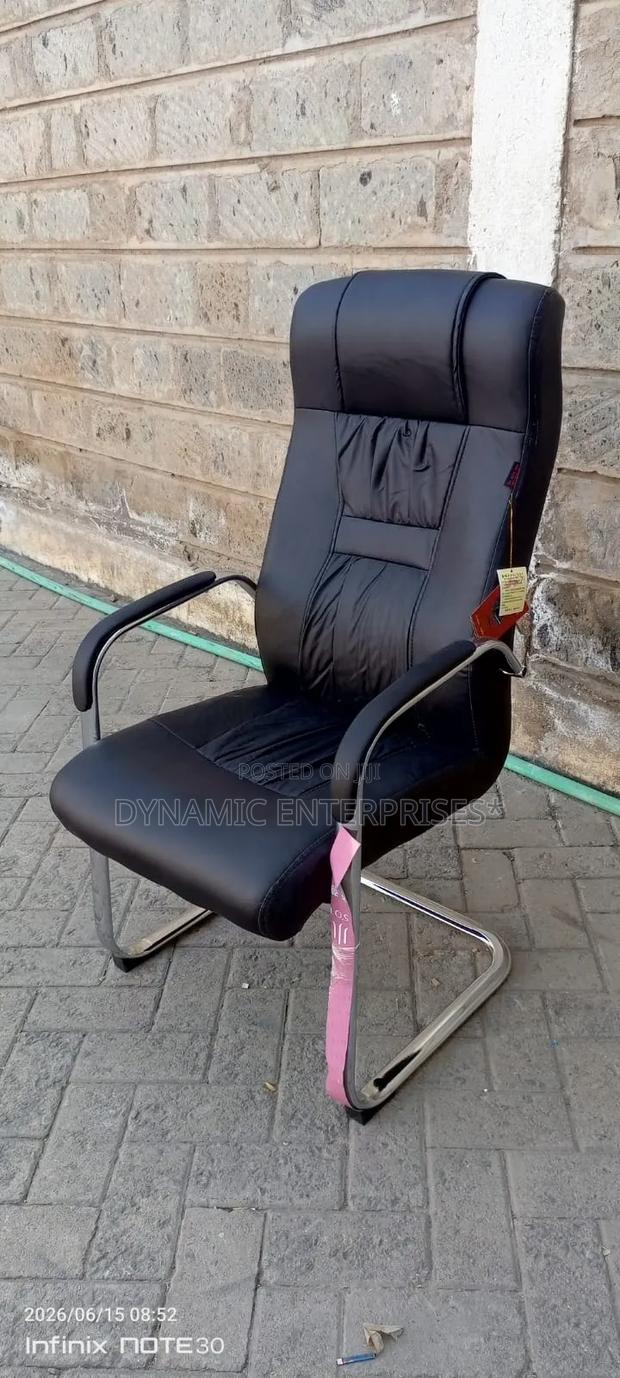 Black Pu Leather Visitor Chair Features a High Backrest and a Polish