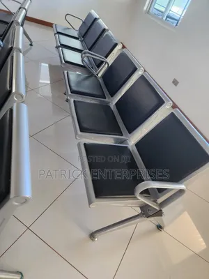 Heavy-Duty Waiting Bay Chair Features Padded Black Seats Metal Frame.
