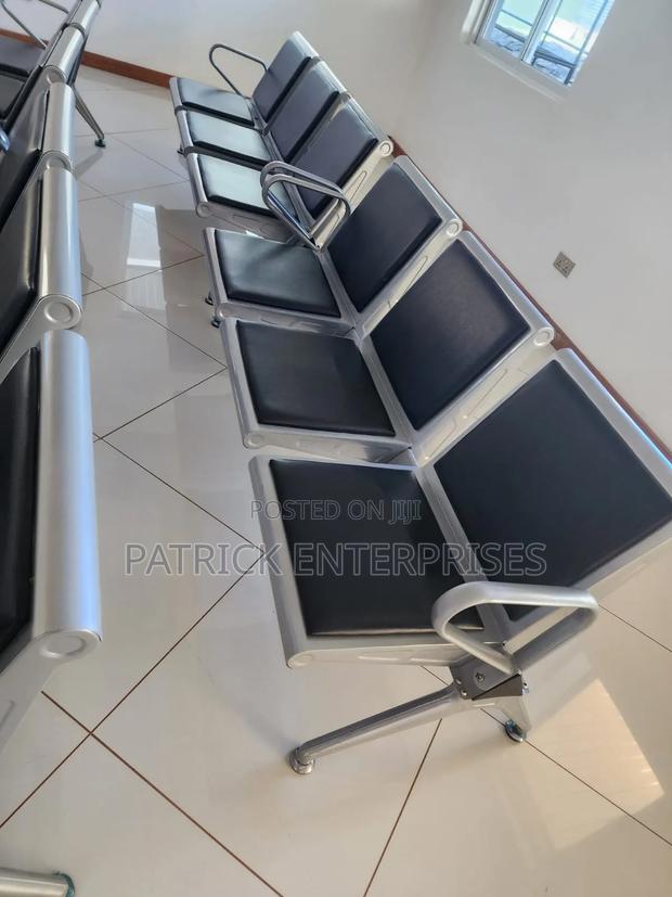 Heavy-Duty Waiting Bay Chair Features Padded Black Seats Metal Frame.