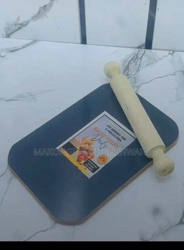 Blue Cutting Board Paired With a Wooden Rolling Pin.