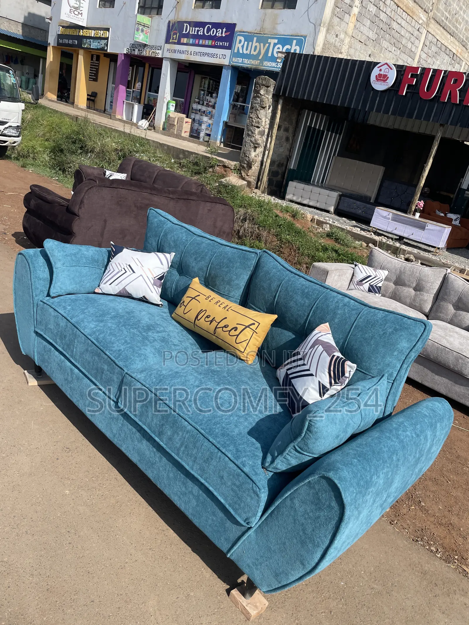 A Classic Three Seater Butterfly Super Sofa