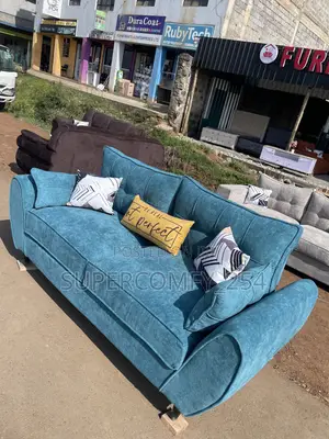 A Classic Three Seater Butterfly Super Sofa
