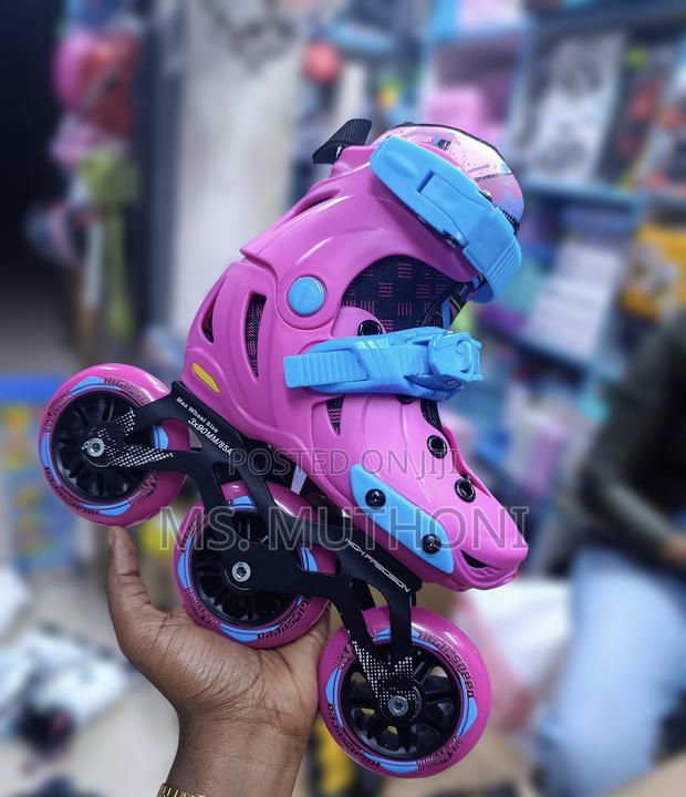 Vibrant Pink and Blue Kids Teens Tri Skate Ft a Sturdy Three-Wheel