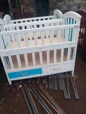 Wooden Baby Cot With Two Levels Is Available