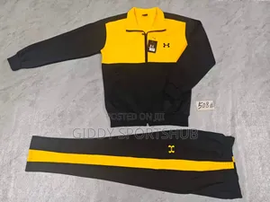 Under Armour Model 1175 Tracksuit Featuring Black and Yellow