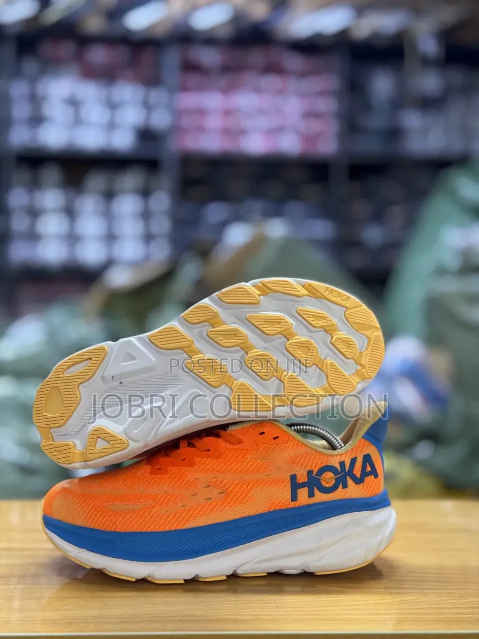 Hoka Clifton 9 Vibrant Orange and Blue Breathable Sneakers