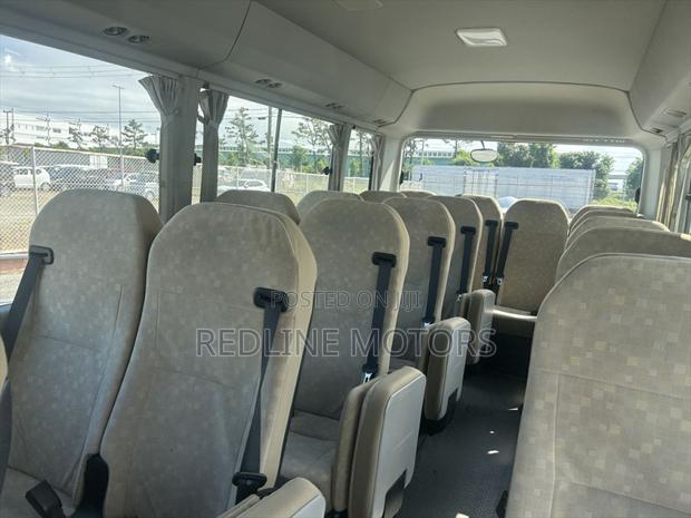 Toyota Coaster 2019 Beige - thumbnail 2