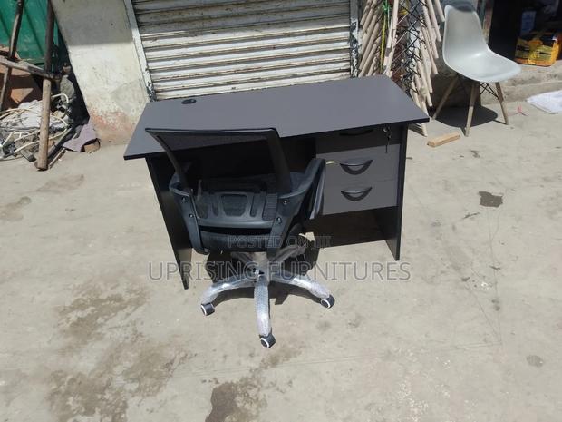Sleek Gray Office Desk With Mesh Chair