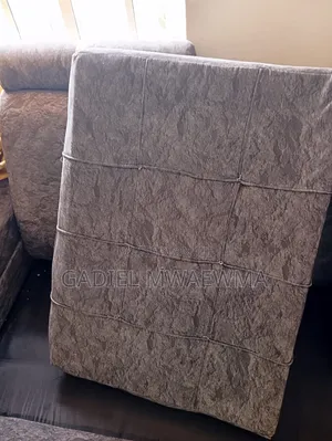 Used Grey L-Shaped Sofa in Good Condition. Comes With Mini Tables