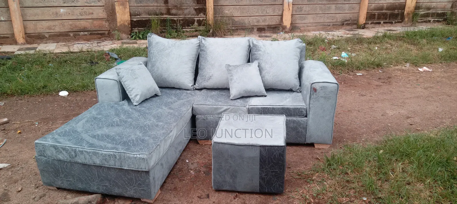 Gray L Seat With a Stool