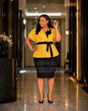 Elegant Peplum Dress
- Comes With a Belt.