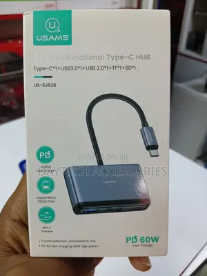 This Is a Usams Us-Sj628 5-in-1 Multifunctional Type-C Hub in a Gray.