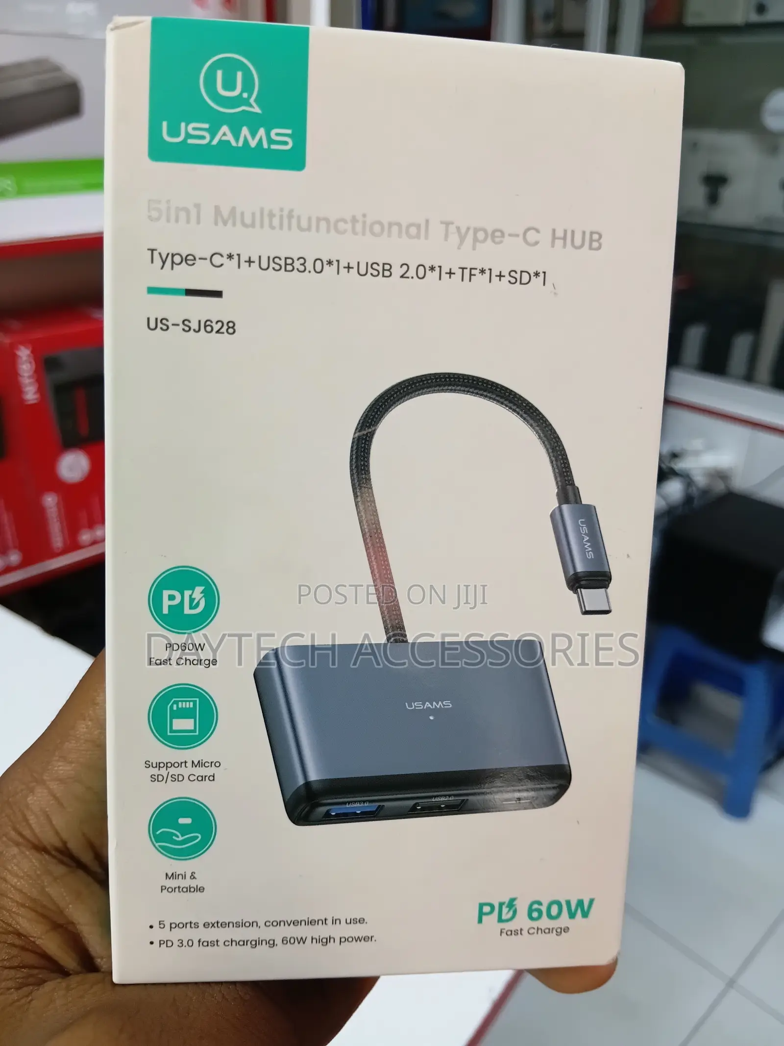 This Is a Usams Us-Sj628 5-in-1 Multifunctional Type-C Hub in a Gray.