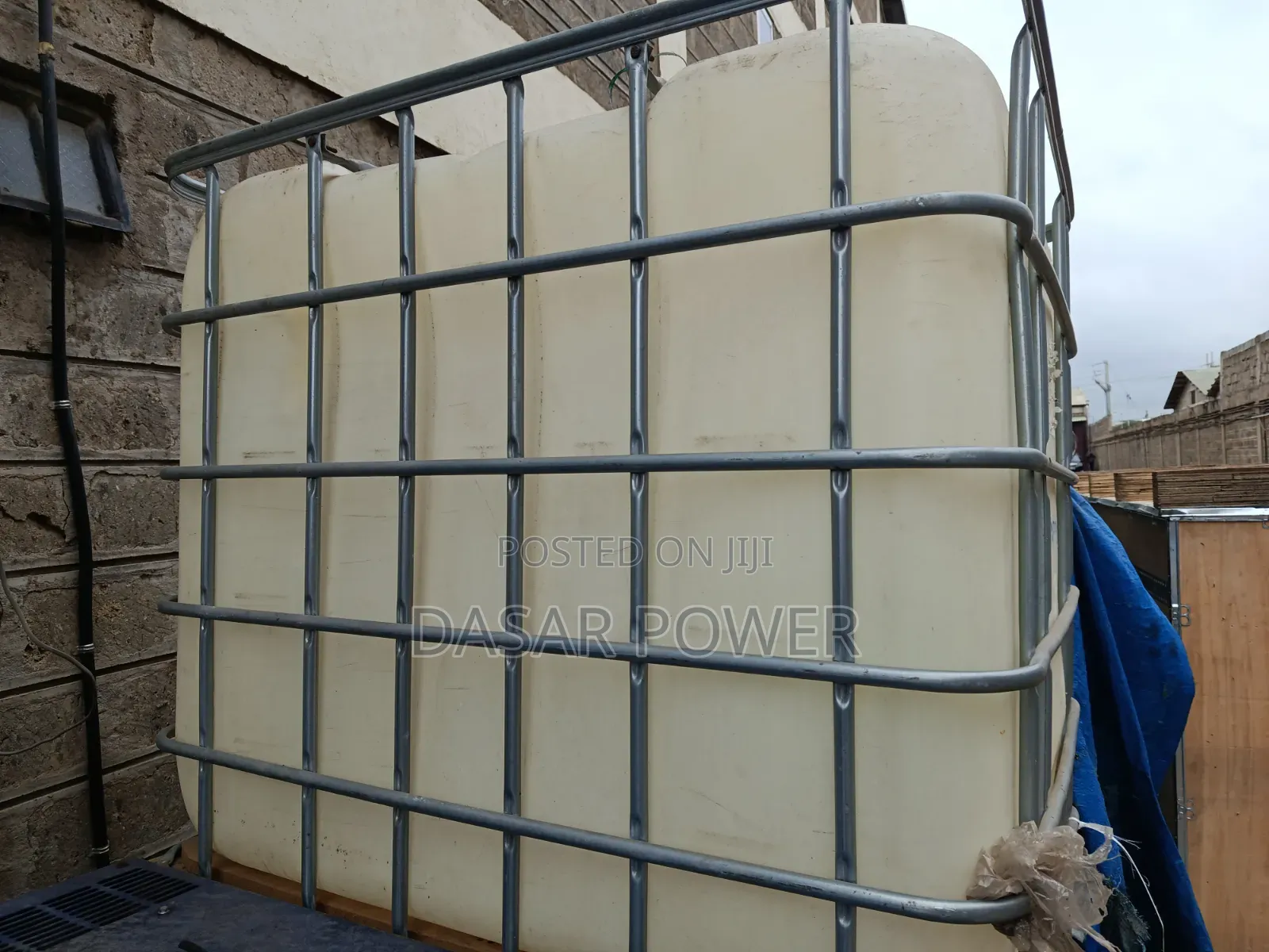 Caged 1000litre Plastic Tanks