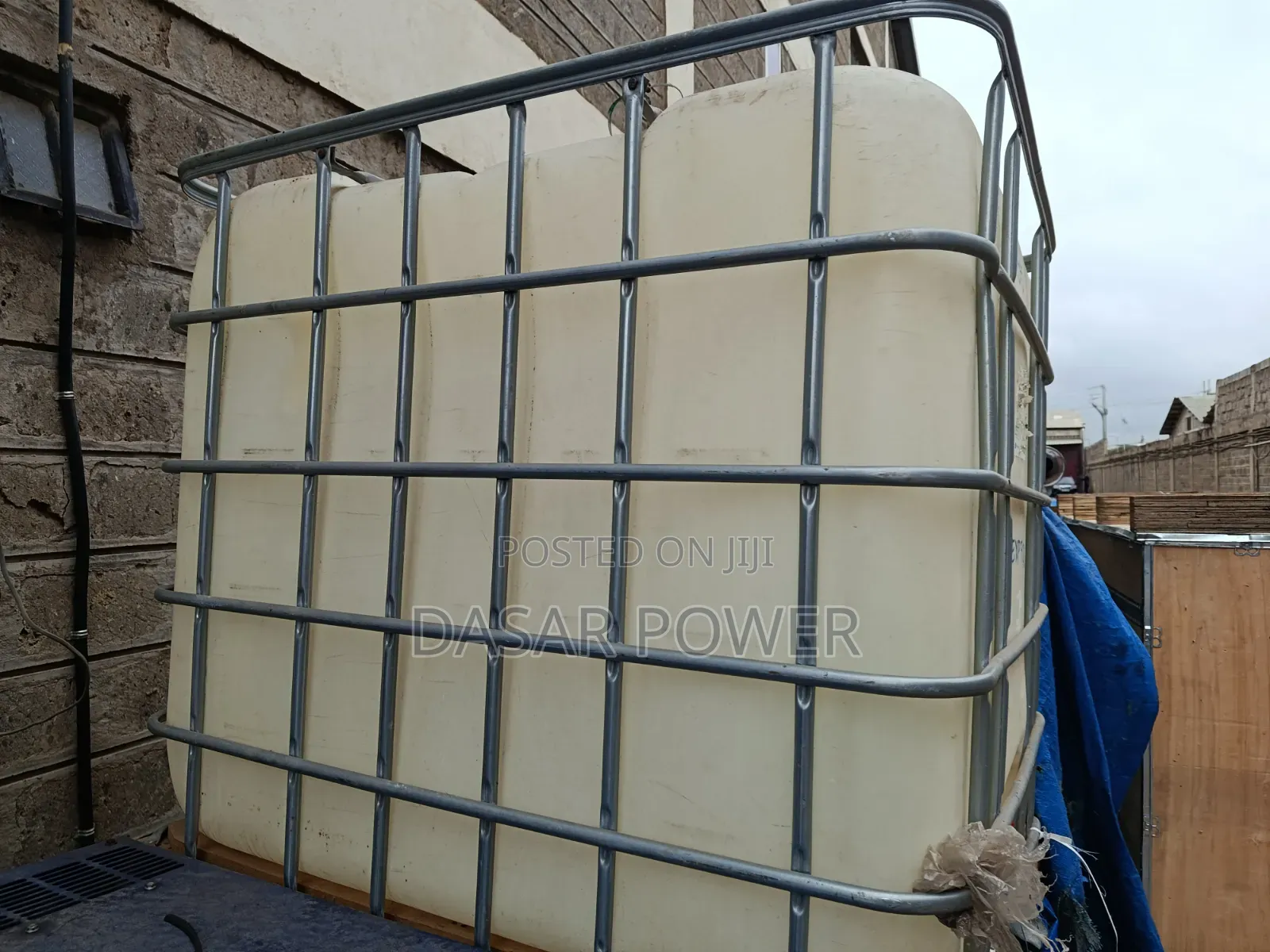 Caged 1000litre Plastic Tanks