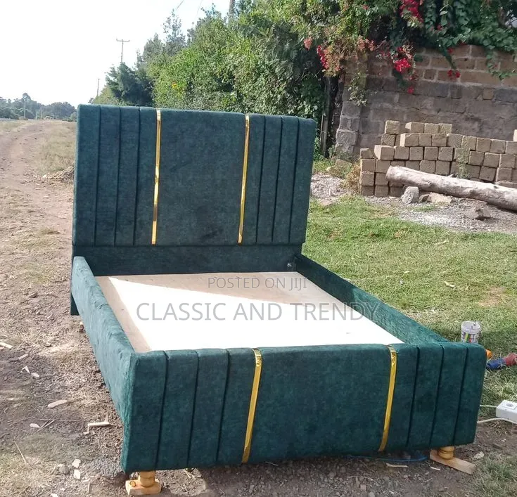 Luxurious Emerald Velvet Bed With Elegant Gold Accents and Style.