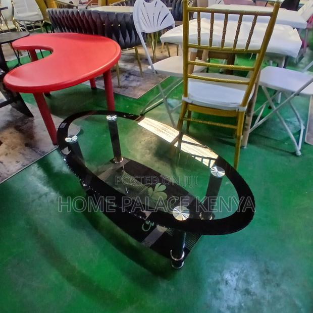 Coffee Table: Minimalist Oval Glass Table With Black Details - thumbnail 2