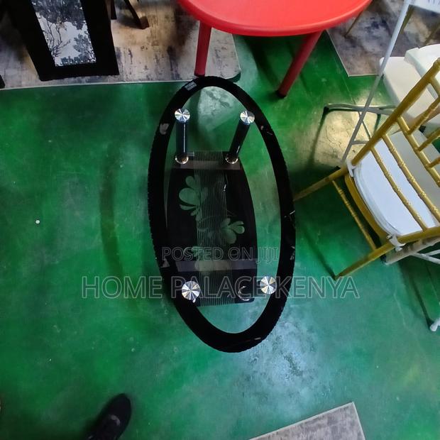 Coffee Table: Minimalist Oval Glass Table With Black Details - thumbnail 4