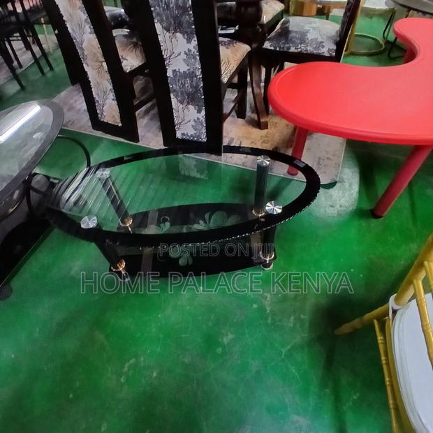 Coffee Table: Minimalist Oval Glass Table With Black Details - thumbnail 5