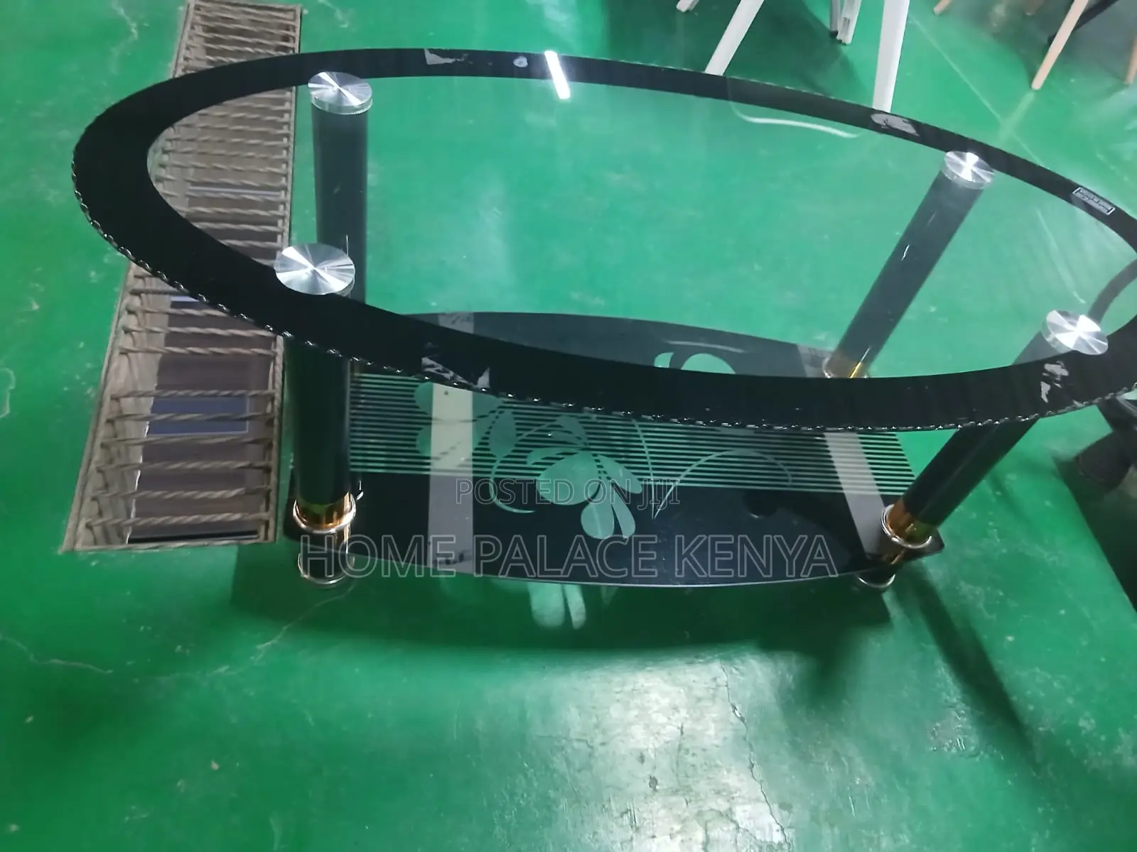 Coffee Table: Minimalist Oval Glass Table With Black Details
