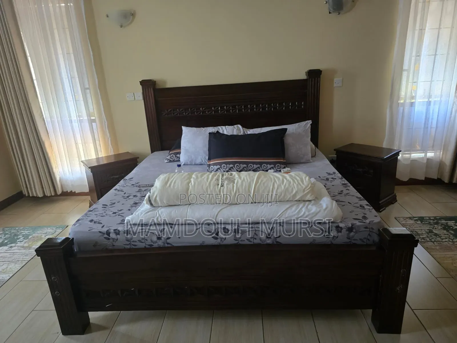 King-Size Bed With Mattress, 2 Nightstands, Dresser, and 3 Rugs.