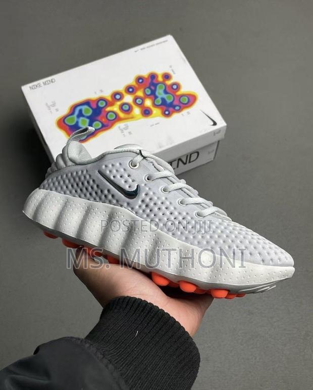 Nike Mind 002 Pregame Shoes in a Light Smoke Grey
