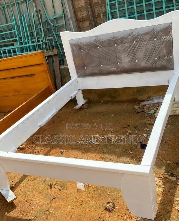 White Wooden Bed With an Upholstered Headboard - thumbnail 2