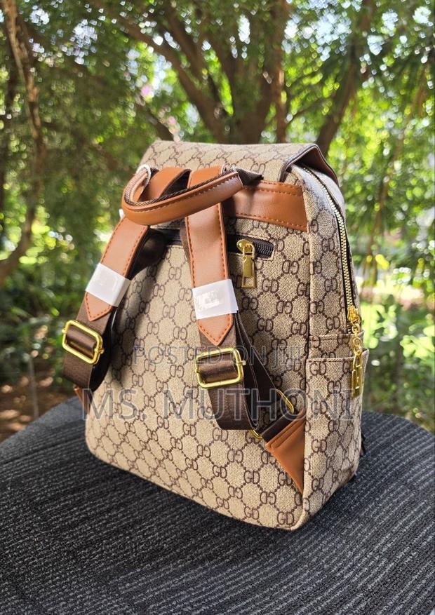 Retro-Style Unisex Backpack Features a Monogram Printed Material - thumbnail 2