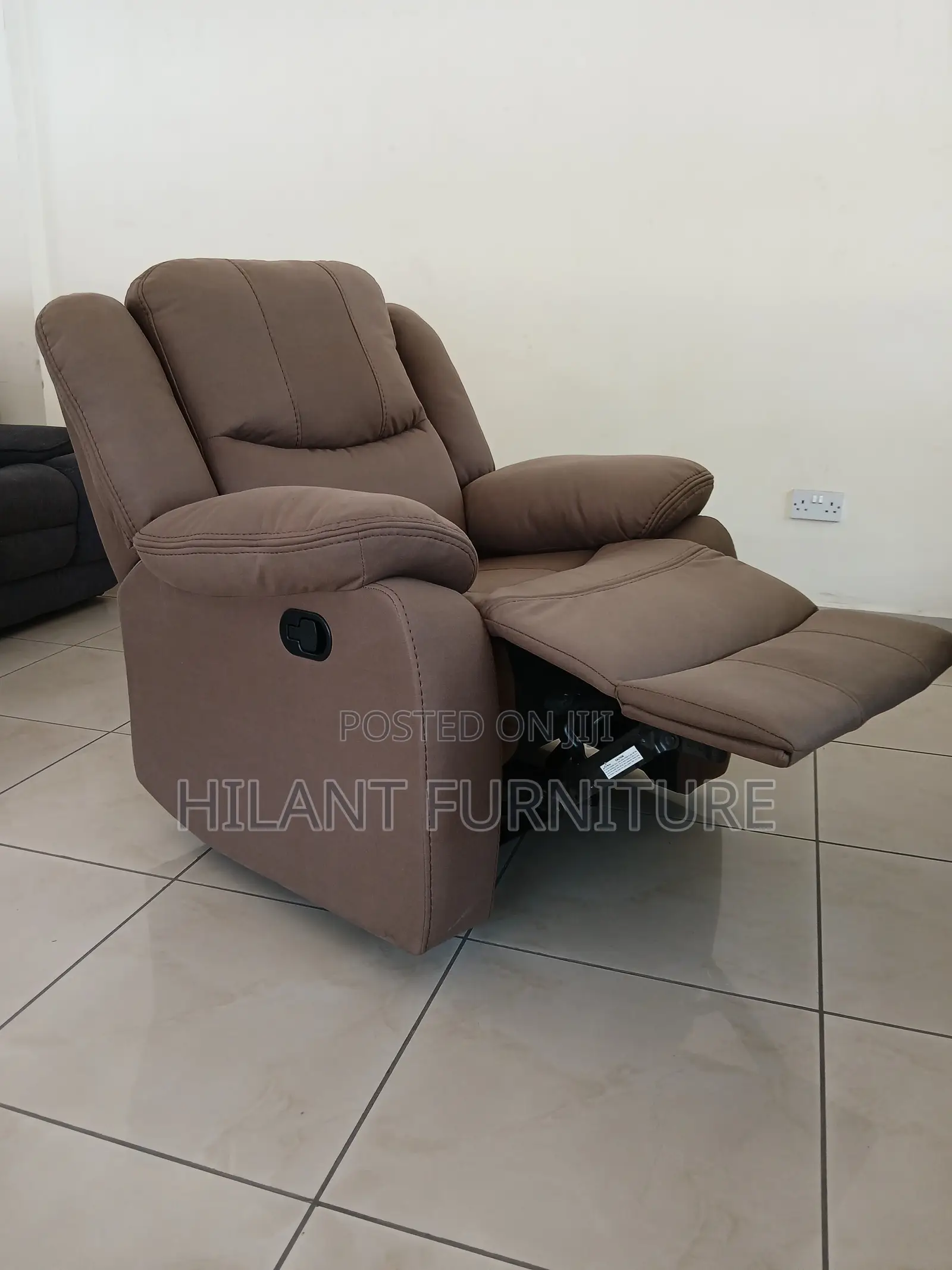 Brown One-Seater Recliner Sofa.