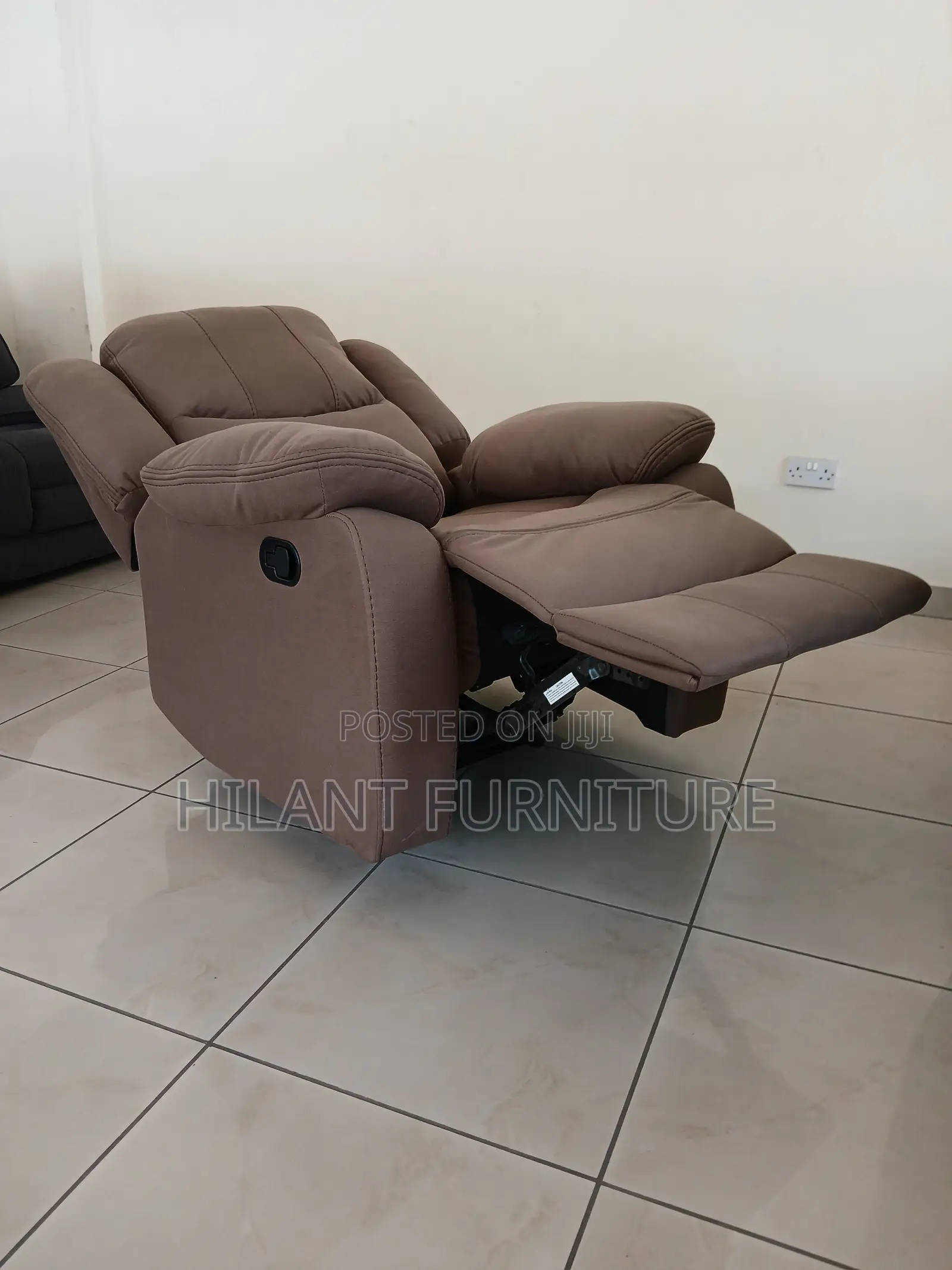 Brown One-Seater Recliner Sofa.