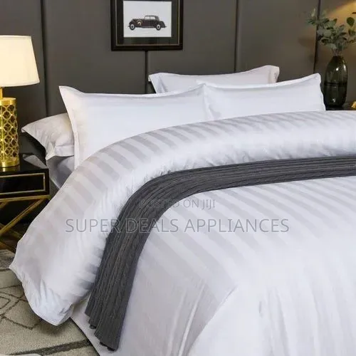 A Pair of a Duvet Cover With a Bedsheet and Two Pillow Cases