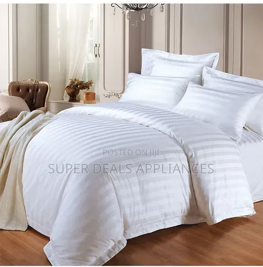 A Pair of a Duvet Cover With a Bedsheet and Two Pillow Cases