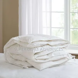 A Set of White Unbinded Duvet With a Bedsheet and Two Pillow Cases