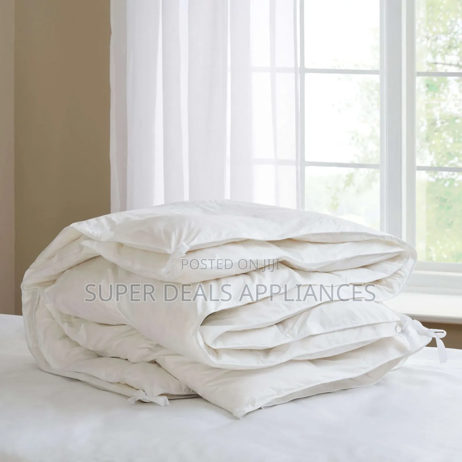 A Set of White Unbinded Duvet With a Bedsheet and Two Pillow Cases