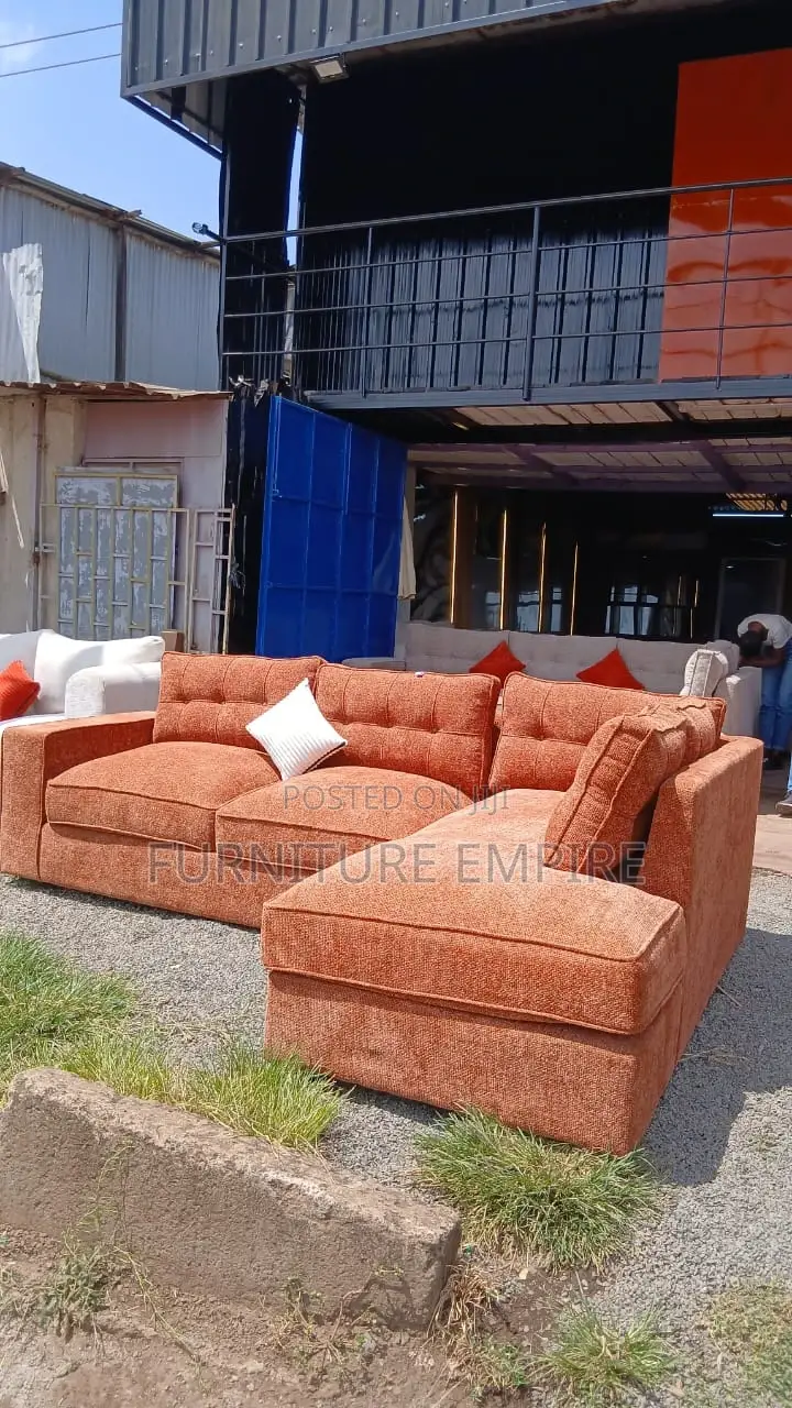 6 Seater Orange L Sofa With Cushions