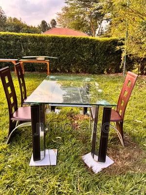Elegant Glass Top Dining Table With 3 Leather Chairs
