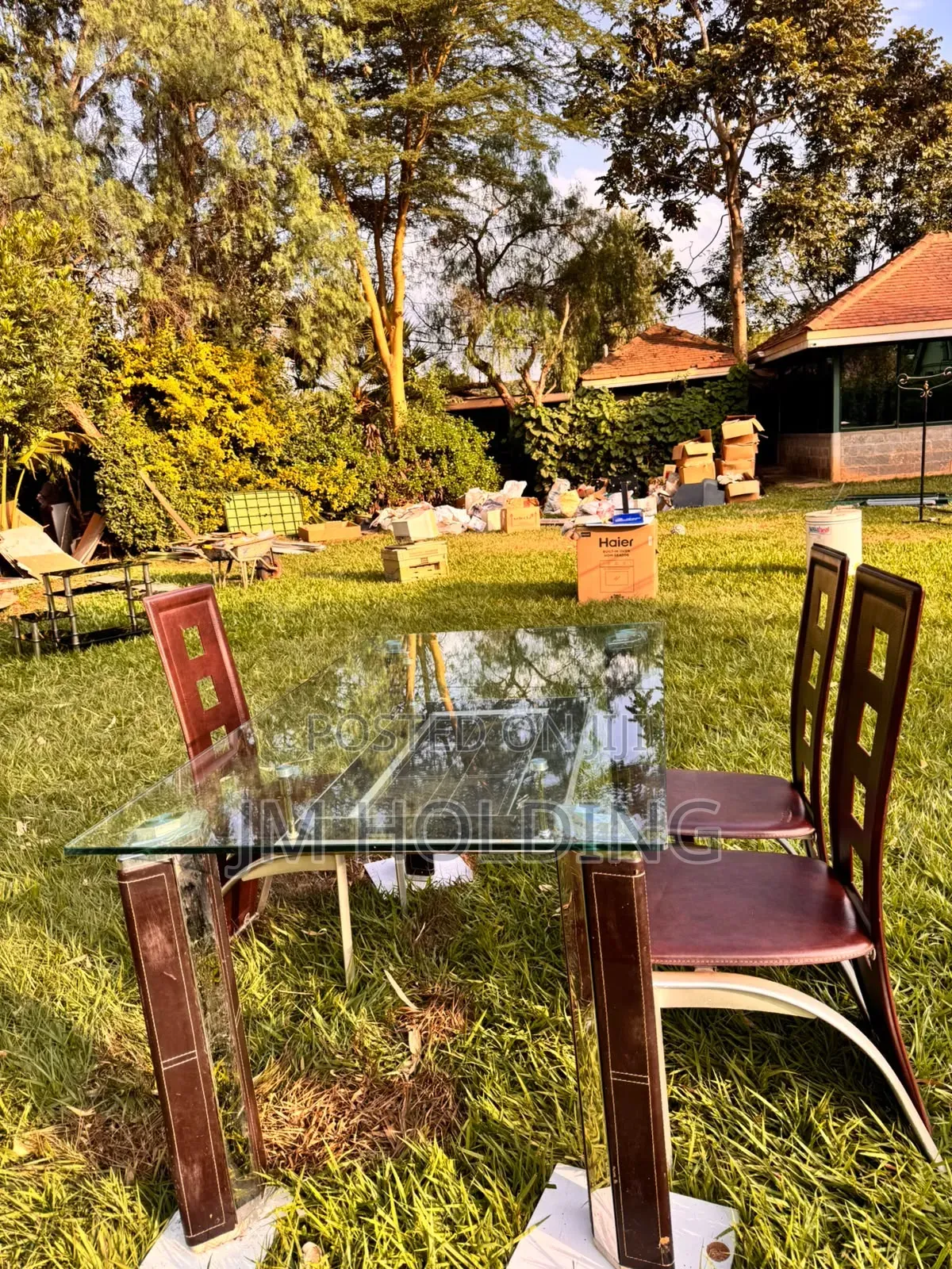 Elegant Glass Top Dining Table With 3 Leather Chairs