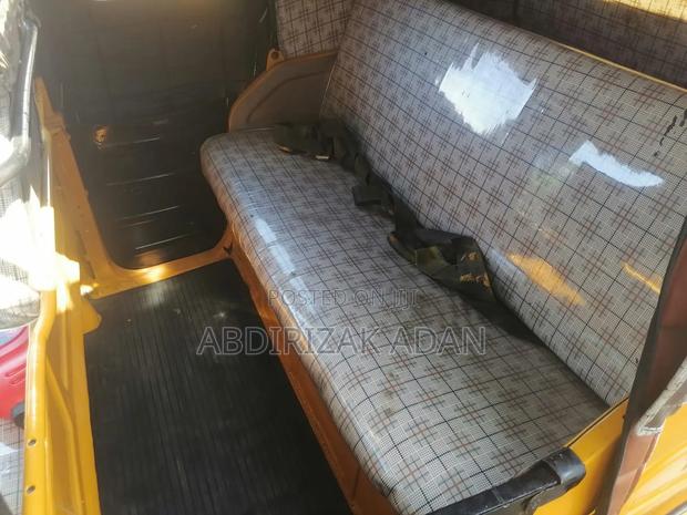 Bajaj RE 2023 Yellow - thumbnail 4