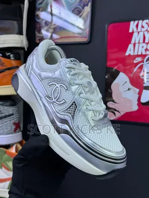 Chanel Trainers in White and Silver.