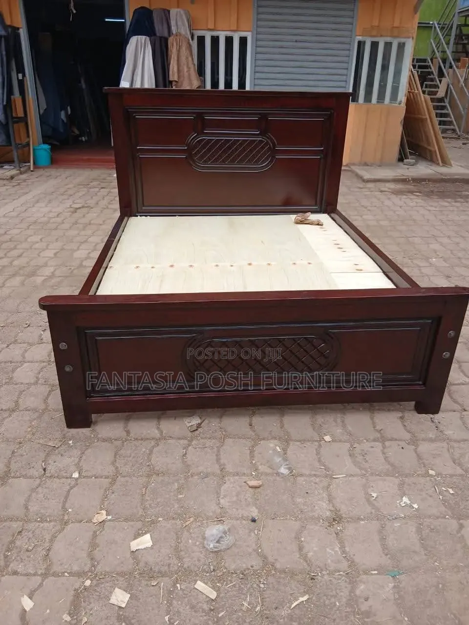 Brown 5 by 6 Wooden Bed