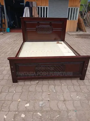Brown 5 by 6 Wooden Bed