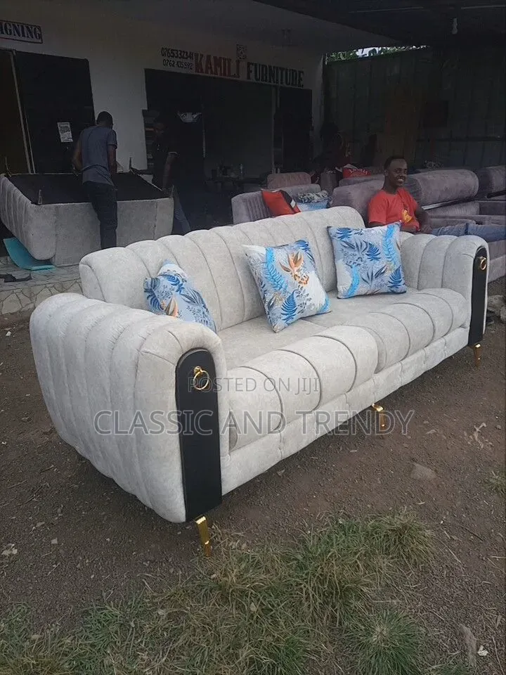 Elegant Cream Sofa 4-Seater With Curved Arms.