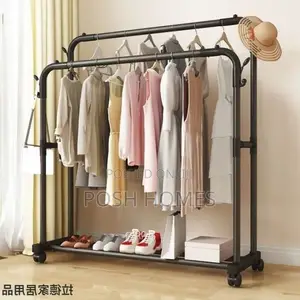 Double Pole Clothing Rack With Wheels Lower Storage Shelf
