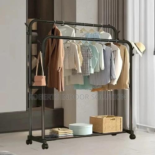 All-in-One Double Pole Garment Rack With Wheels and Storage Floor
