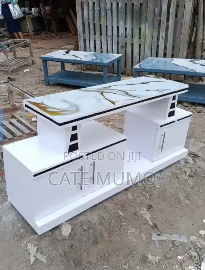 A Tv Stand With Mable Top