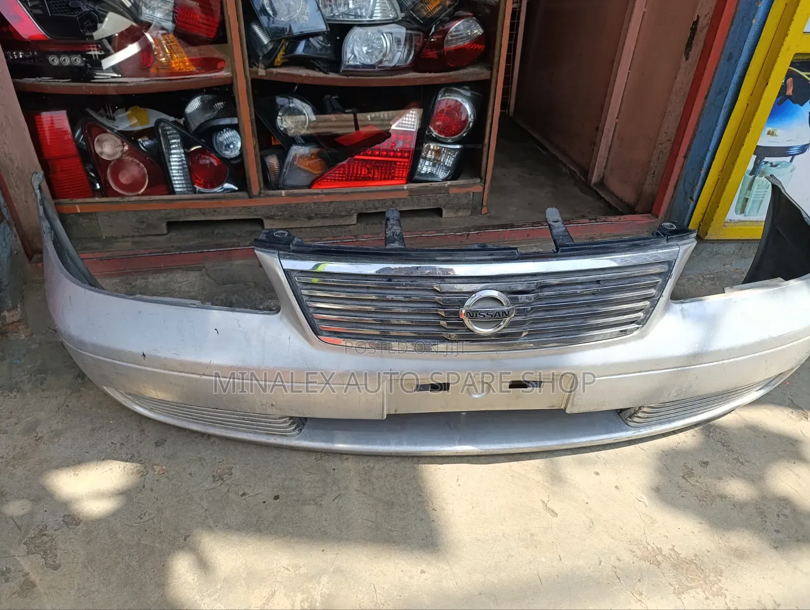 Bumper Front Nissan Ad Complete With Grill and Covers