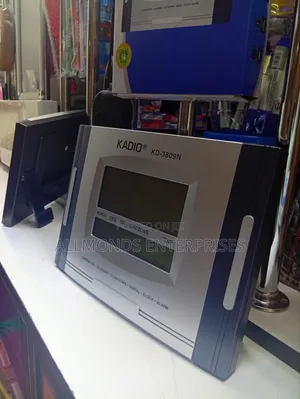 KADIO Wall Clock/ Stand- Inbuilt Calender, Alarm, Temperature!